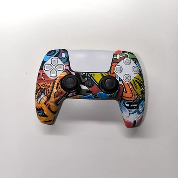 PlayStation 5 - DualSense kontroller szilikonosvédő graffity orange